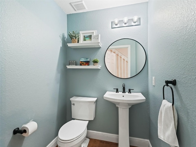 bathroom with sink and toilet