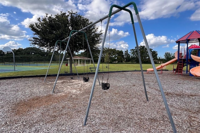 view of play area with a lawn, basketball court, and tennis court