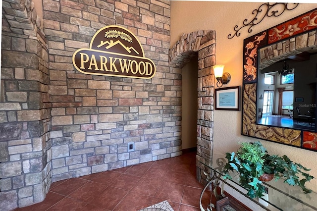 interior space featuring dark tile patterned floors