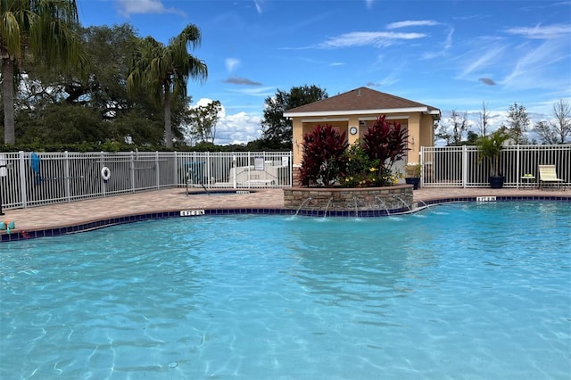 view of swimming pool featuring pool water feature