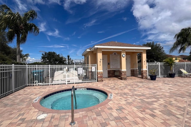 view of pool with a community hot tub