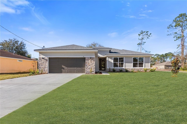 view of front facade with a front yard and a garage