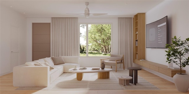 sitting room with ceiling fan and light hardwood / wood-style flooring