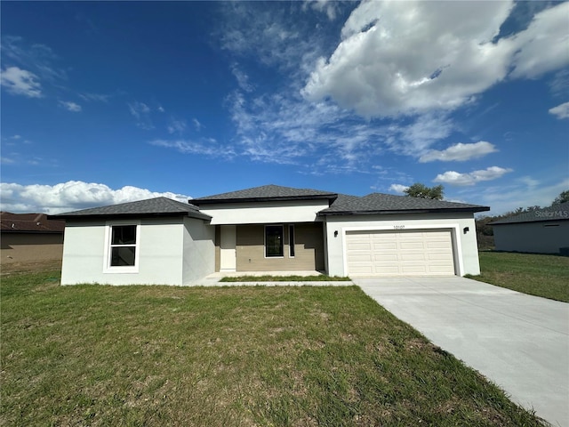 10107 SW 41st Ave, Ocala, FL 34476 - prairie-style house with stucco siding, an attached garage, a front lawn, and concrete driveway