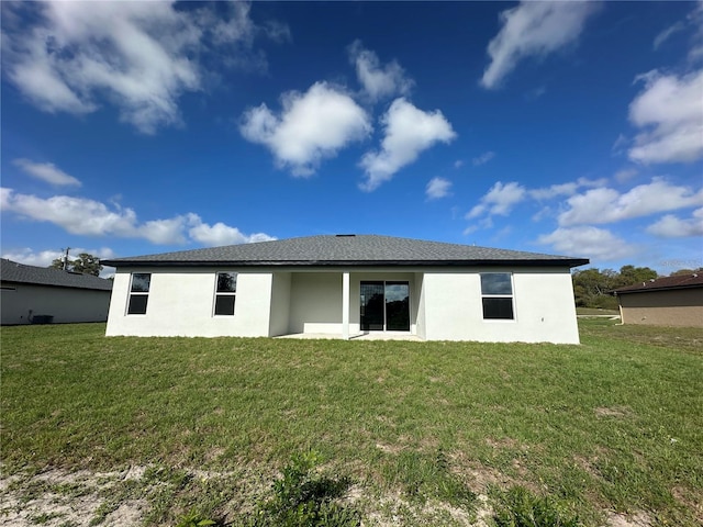 10107 SW 41st Ave, Ocala, FL 34476 - back of property featuring stucco siding and a lawn