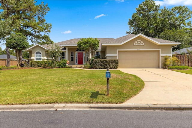 ranch-style house featuring a garage and a front lawn