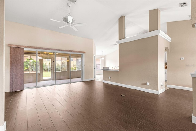 unfurnished living room featuring visible vents, baseboards, a ceiling fan, and dark wood-style floors