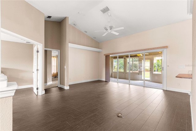 unfurnished living room with high vaulted ceiling, dark wood-type flooring, a ceiling fan, visible vents, and baseboards