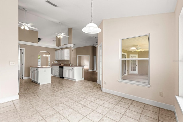 kitchen with ceiling fan, white cabinetry, visible vents, dishwasher, and lofted ceiling