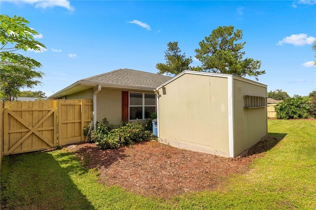 view of side of home featuring a yard