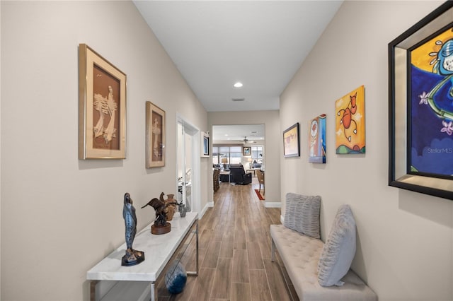 hallway featuring wood-type flooring