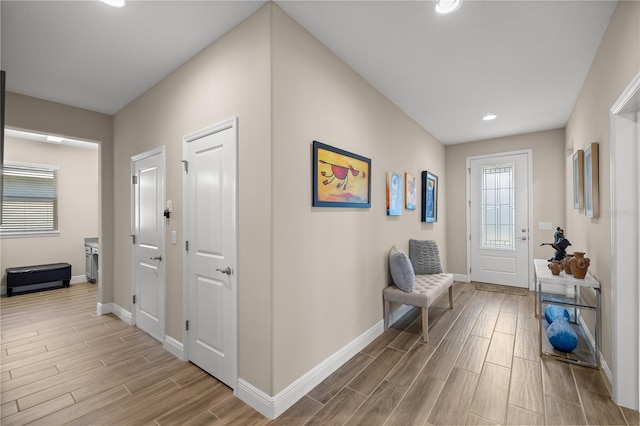 corridor with light wood-type flooring