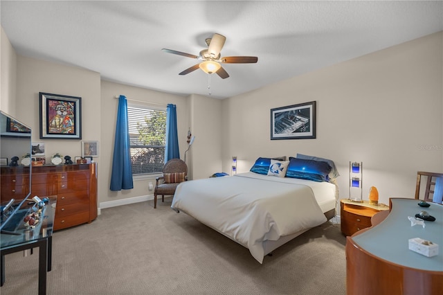 bedroom with light carpet and ceiling fan