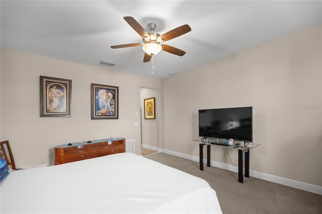 bedroom with light carpet and ceiling fan