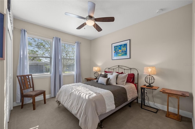 bedroom featuring ceiling fan and light colored carpet