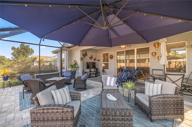 view of patio / terrace with glass enclosure and outdoor lounge area