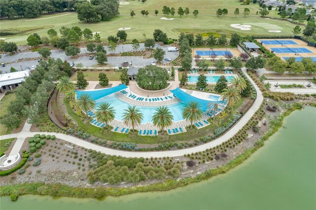 birds eye view of property with a water view