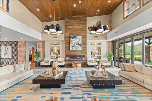 living room with high vaulted ceiling, wood ceiling, and an inviting chandelier