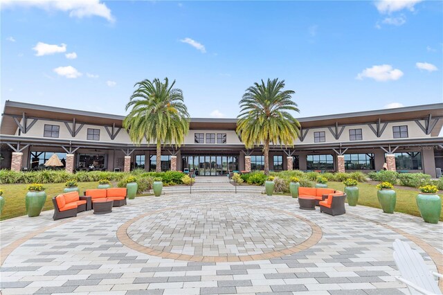 view of property's community featuring a patio area