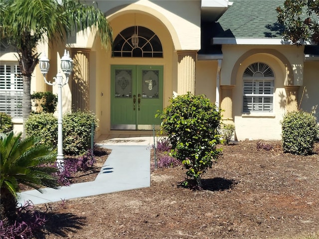 property entrance featuring french doors