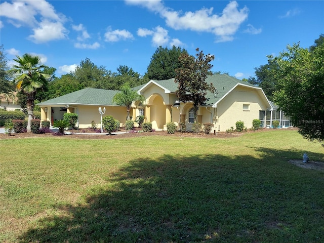 ranch-style house with a front lawn