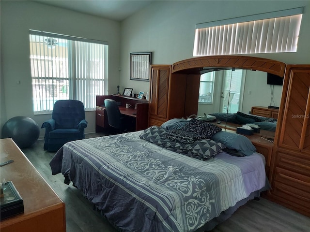 bedroom with hardwood / wood-style flooring