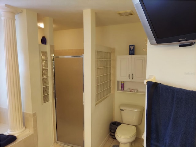 bathroom featuring walk in shower, decorative columns, tile patterned flooring, and toilet