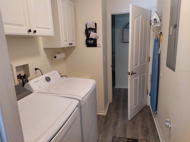 laundry room with cabinets, dark hardwood / wood-style floors, and washing machine and clothes dryer