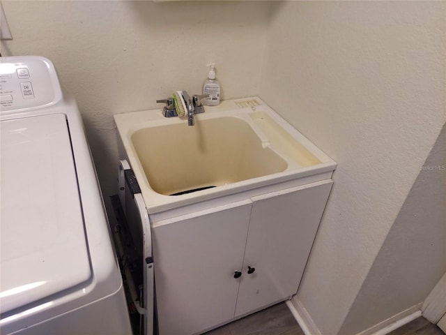 bathroom featuring washer / clothes dryer and vanity