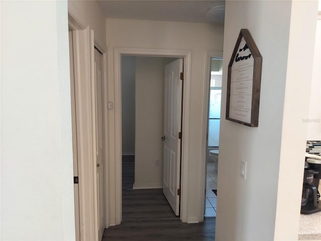 hallway featuring dark hardwood / wood-style floors