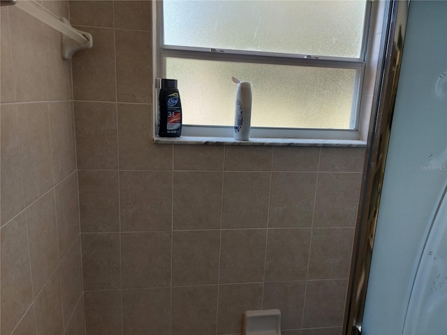 room details featuring a shower with shower door