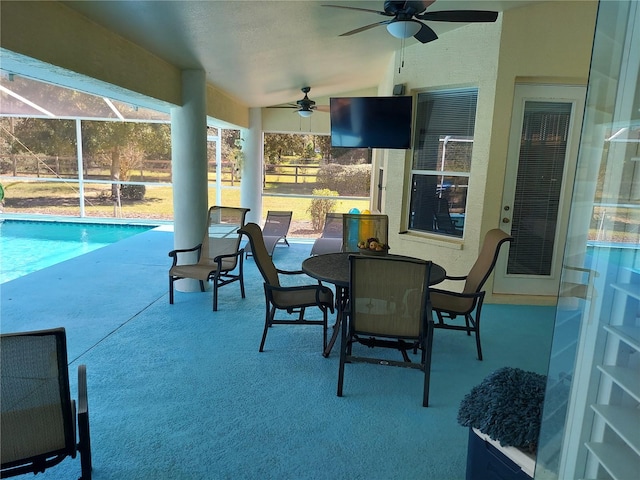 view of patio with a lanai and ceiling fan