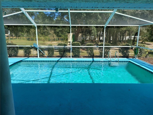 view of pool featuring a lanai