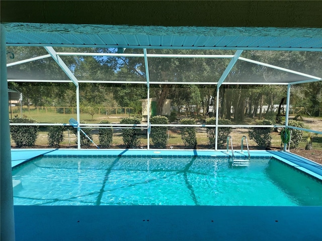 view of pool with a lanai