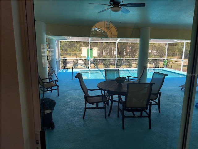 interior space featuring a pool and ceiling fan