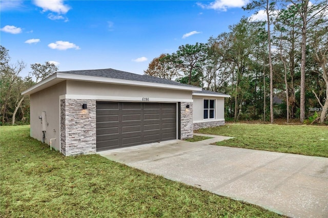 view of front of home featuring a garage and a front lawn