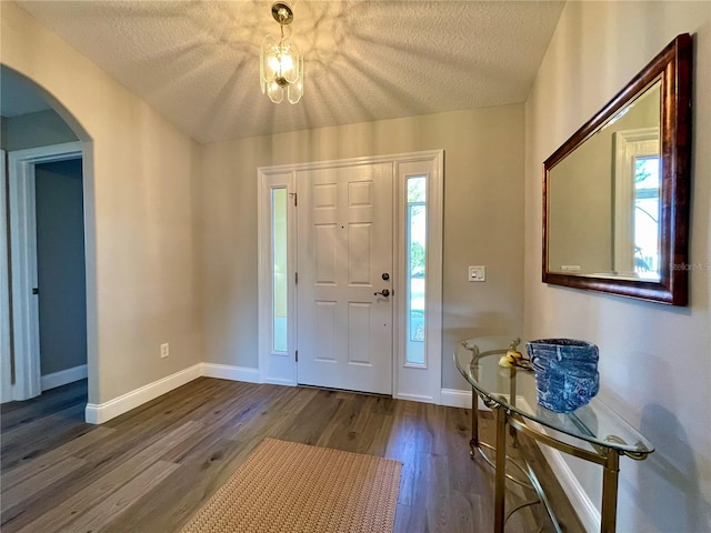 entrance foyer featuring hardwood / wood-style flooring and a textured ceiling