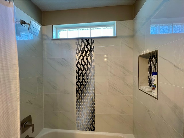 bathroom with shower / bathtub combination with curtain