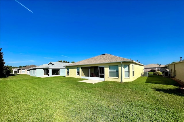 back of house featuring a yard