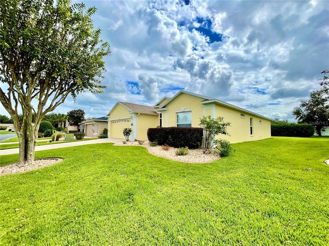 view of property exterior with a garage and a lawn