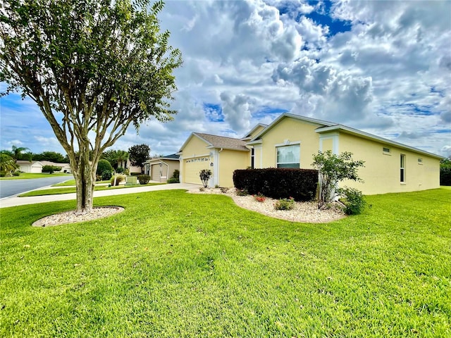 view of property exterior featuring a garage and a yard