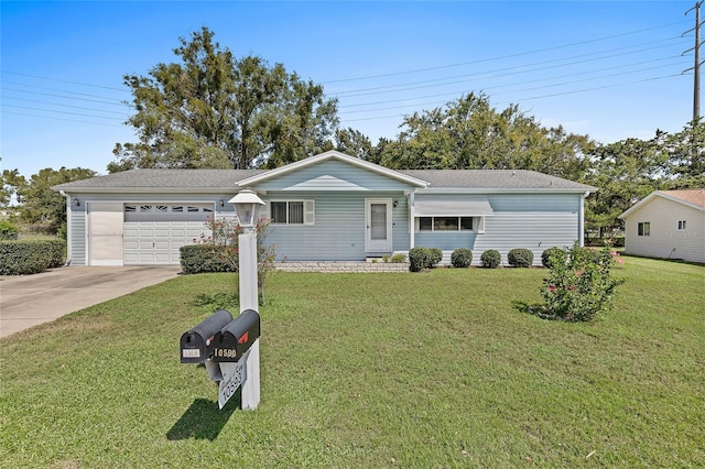 single story home featuring a garage, a front yard, and driveway