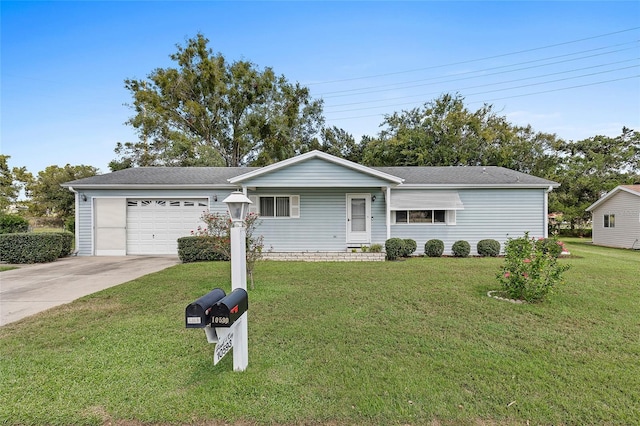 ranch-style house with a garage, concrete driveway, and a front yard