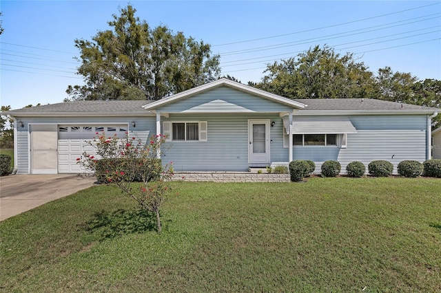 ranch-style house featuring a garage, driveway, and a front lawn