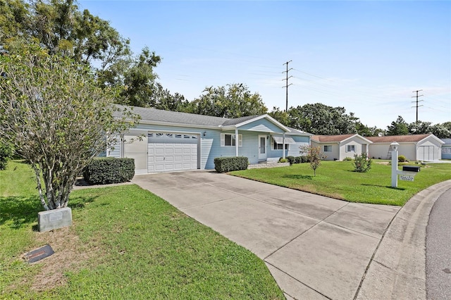 ranch-style house with a garage, concrete driveway, and a front yard