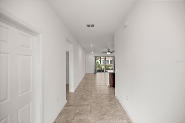 hallway with light tile patterned floors