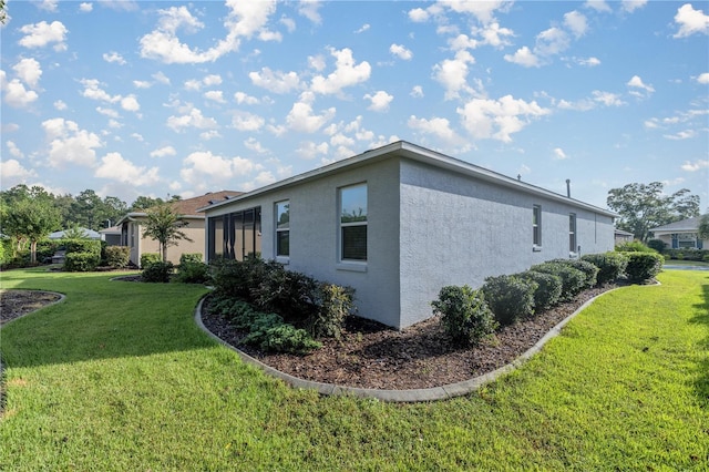 view of property exterior featuring a lawn