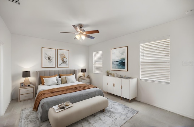 bedroom with light carpet and ceiling fan