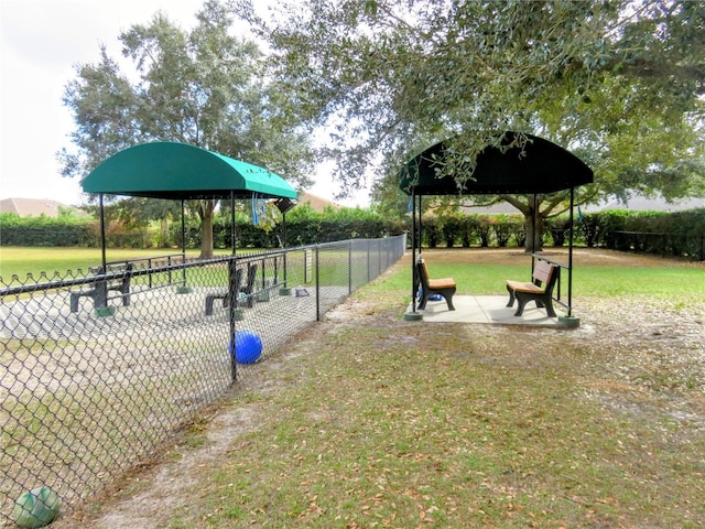 view of property's community with a gazebo and a yard