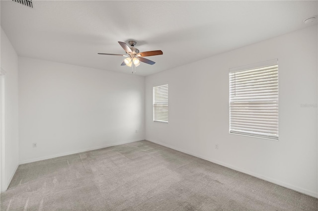 carpeted empty room with ceiling fan